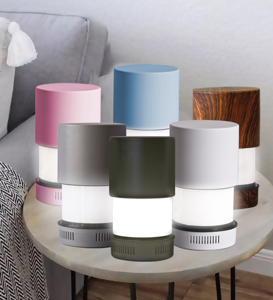 The KosherLamp 360 shabbos lamp shown in six colors, glowing softly on a side table
